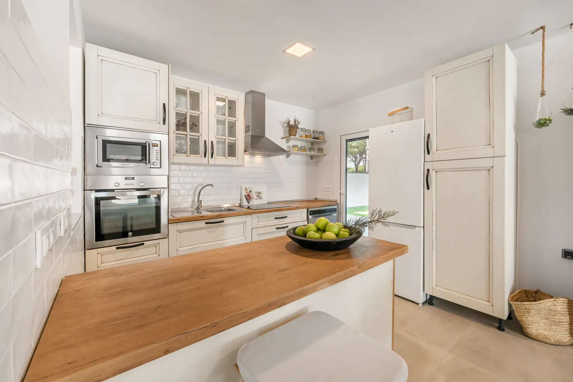 Country kitchen with peninsula, oven and fridge